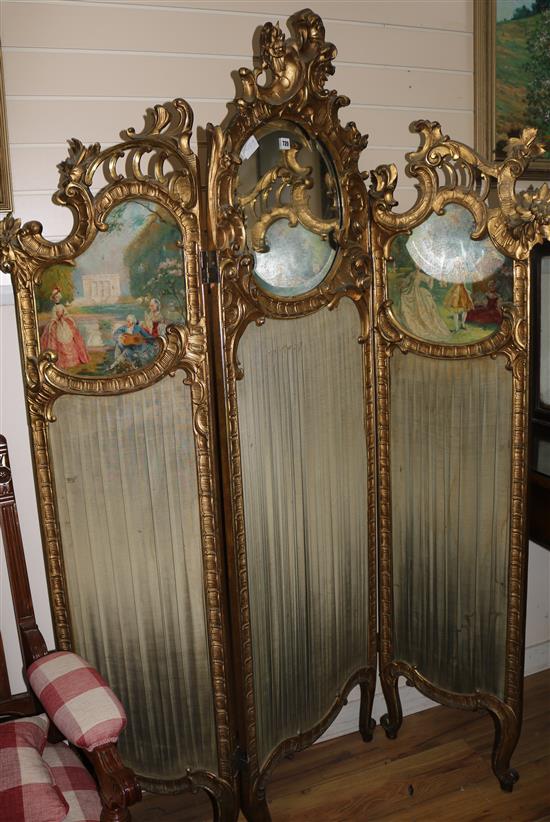 An Edwardian Louis XV style carved giltwood three fold dressing screen, H.187cm